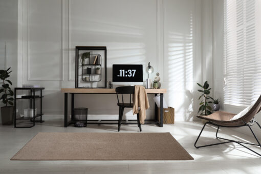 Room interior with comfortable workplace. Modern computer on woo